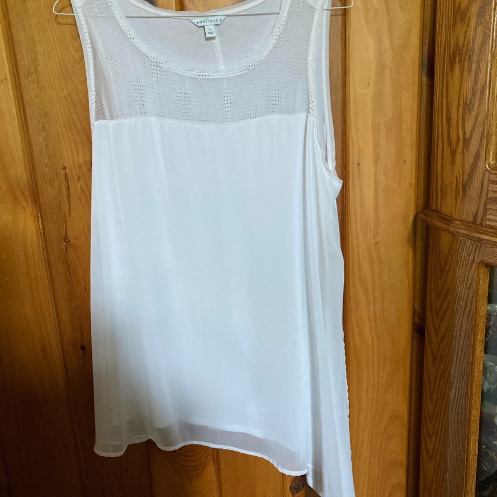 White women’s short sleeved top by BOUTIQUE. 1X.  Altered hem. Silver bling